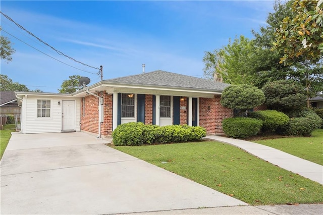 9424 Sharla Dr, River Ridge, LA 70123 - single story home featuring roof with shingles, driveway, brick siding, and a front yard