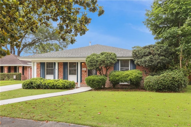 9424 Sharla Dr, River Ridge, LA 70123 - ranch-style house featuring a shingled roof, brick siding, and a front yard