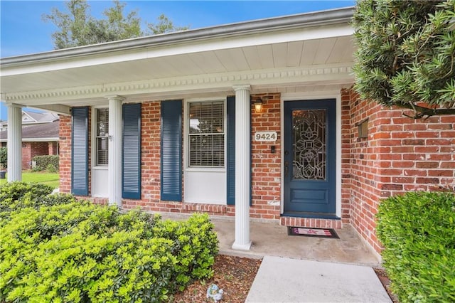 9424 Sharla Dr, River Ridge, LA 70123 - property entrance featuring brick siding and a porch