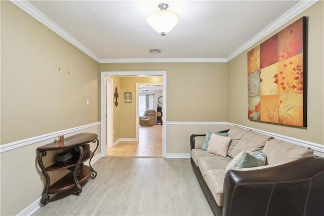 9424 Sharla Dr, River Ridge, LA 70123 - living area with crown molding, visible vents, light wood-style flooring, and baseboards