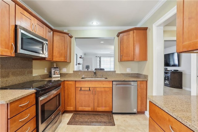 9424 Sharla Dr, River Ridge, LA 70123 - kitchen with a sink, crown molding, light stone counters, and appliances with stainless steel finishes