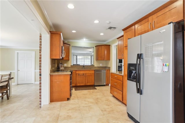 9424 Sharla Dr, River Ridge, LA 70123 - kitchen featuring crown molding, appliances with stainless steel finishes, brown cabinets, and a sink