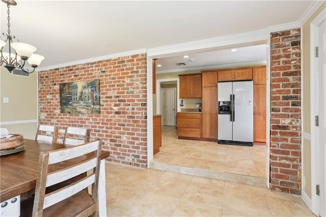 9424 Sharla Dr, River Ridge, LA 70123 - kitchen with brown cabinetry, light tile patterned floors, refrigerator with ice dispenser, a chandelier, and crown molding