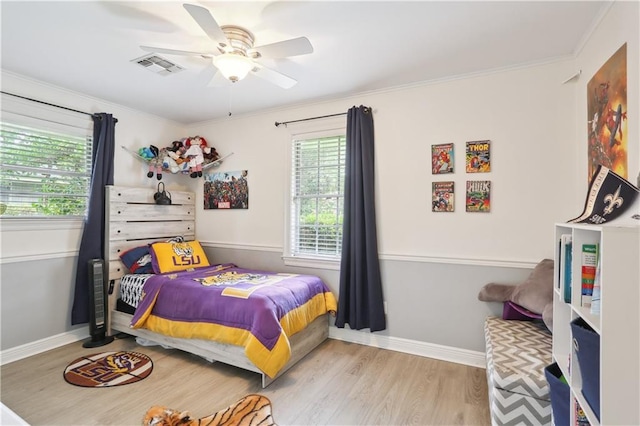 9424 Sharla Dr, River Ridge, LA 70123 - bedroom with crown molding, baseboards, visible vents, and wood finished floors