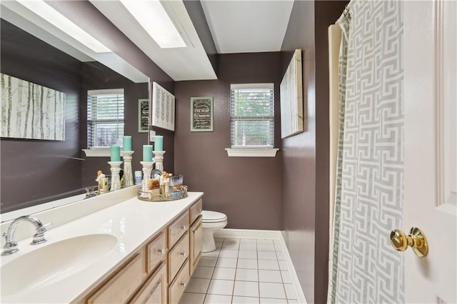 9424 Sharla Dr, River Ridge, LA 70123 - full bath with tile patterned floors, toilet, baseboards, and vanity