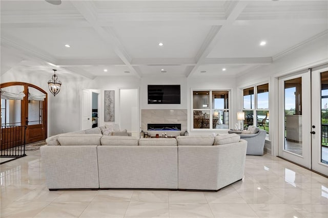 living area featuring french doors, recessed lighting, a fireplace, beamed ceiling, and coffered ceiling