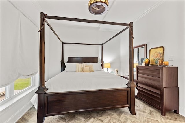 bedroom with baseboards and ornamental molding