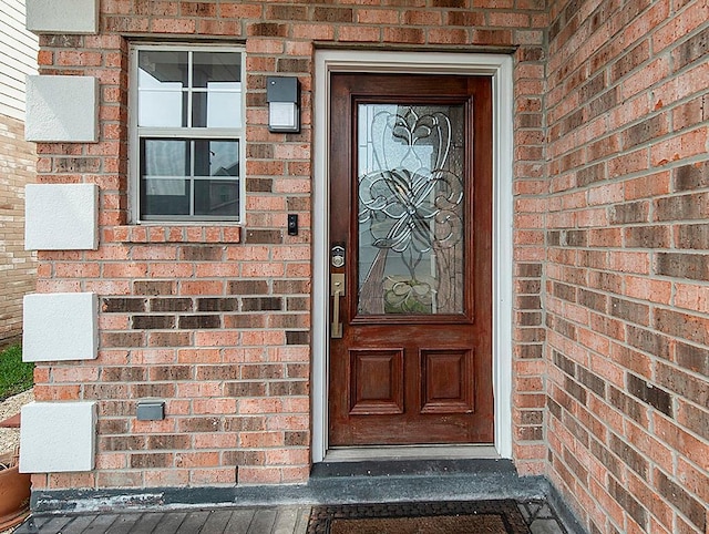 1001 W Chateau Lafitte Dr, Kenner, LA 70065 - doorway to property with brick siding