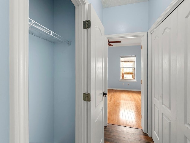 1001 W Chateau Lafitte Dr, Kenner, LA 70065 - corridor with hardwood / wood-style floors and baseboards