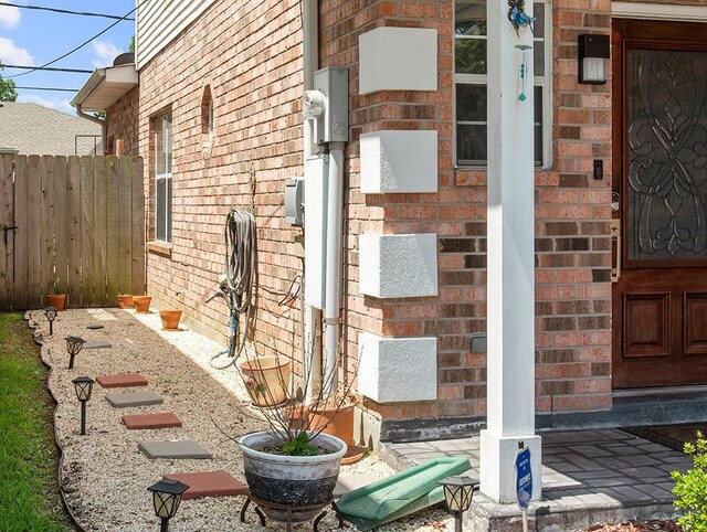 1001 W Chateau Lafitte Dr, Kenner, LA 70065 - view of exterior entry with brick siding