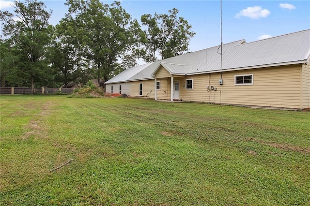 44449 W Pleasant Ridge Rd, Hammond, LA 70403 - back of property with a yard, metal roof, and fence