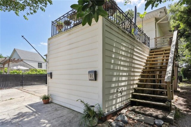 3537 Thrasher St, New Orleans, LA 70124 - view of home's exterior with stairway and a patio area