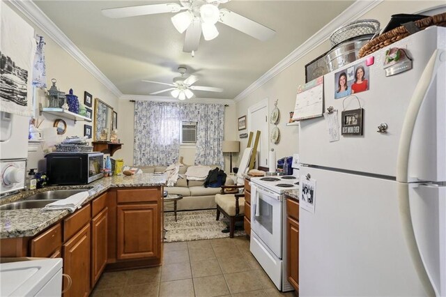 3537 Thrasher St, New Orleans, LA 70124 - kitchen featuring white appliances, a ceiling fan, brown cabinets, ornamental molding, and light tile patterned floors