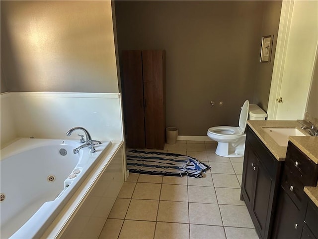 41139 Happywoods Rd, Hammond, LA 70403 - full bath featuring toilet, vanity, tile patterned floors, a jetted tub, and baseboards
