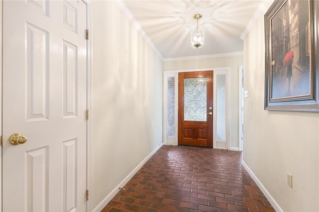foyer with baseboards, ornamental molding, and brick floor