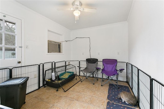 interior space featuring crown molding, light tile patterned flooring, and ceiling fan