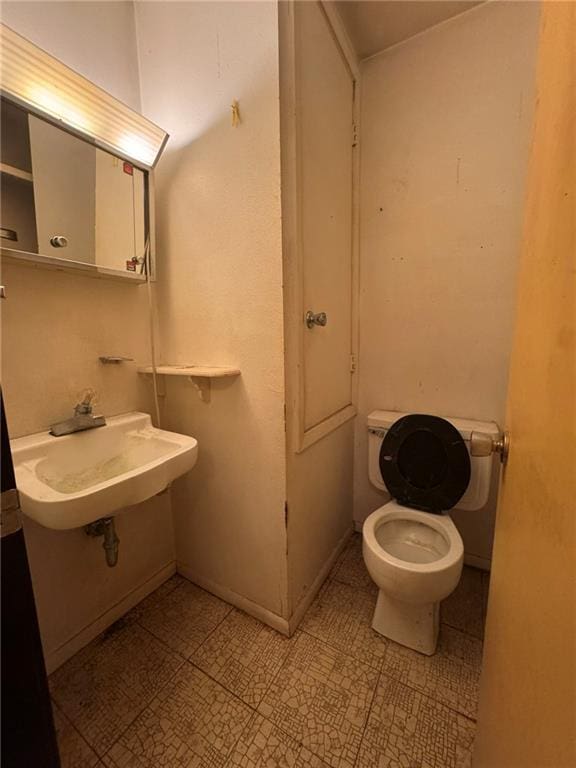bathroom with a sink and toilet