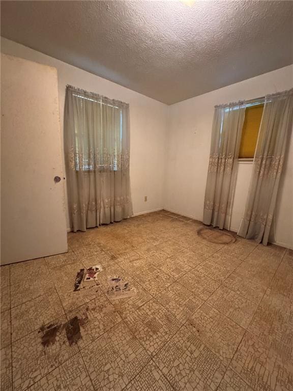 unfurnished bedroom featuring a textured ceiling
