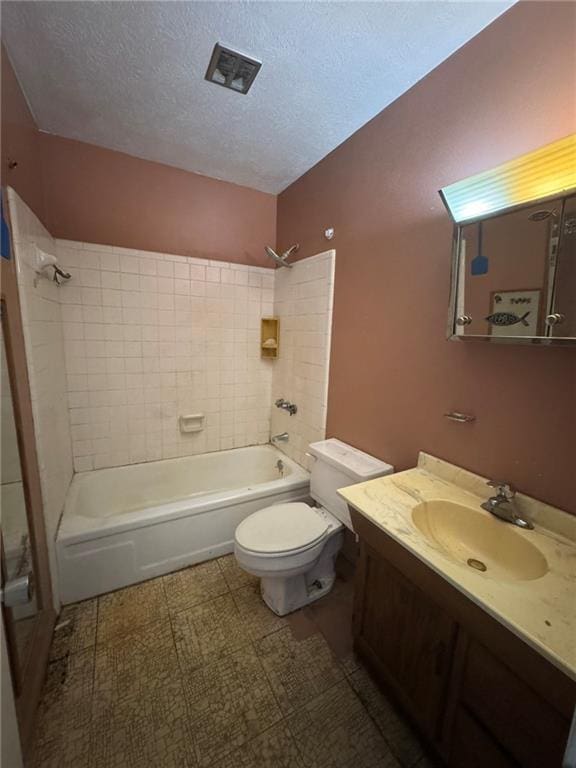 full bath featuring toilet,  shower combination, vanity, and a textured ceiling