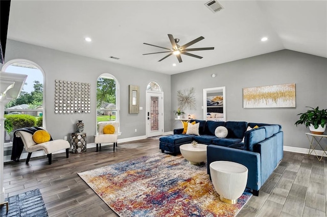 living room featuring a ceiling fan, recessed lighting, baseboards, visible vents, and wood finished floors