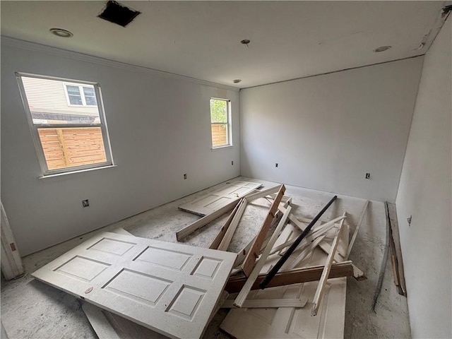 unfurnished room featuring crown molding