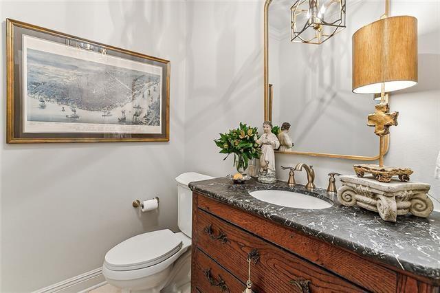 123 N Livingston Pl, Metairie, LA 70005 - half bathroom featuring toilet and vanity