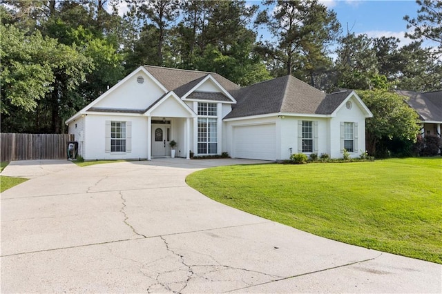 view of front of property featuring a garage, fence, a shingled roof, a front yard, and driveway