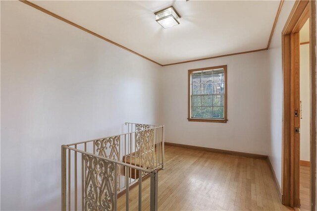3025 Jefferson Ave, New Orleans, LA 70125 - hallway with an upstairs landing, wood finished floors, baseboards, and crown molding