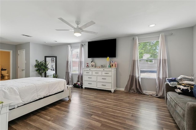 bedroom with recessed lighting, dark wood-style floors, visible vents, and multiple windows