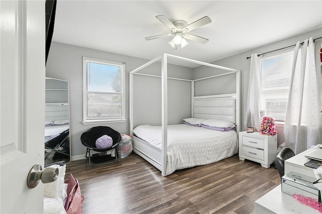 bedroom with ceiling fan and wood finished floors