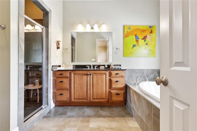 335 Joseph St, New Orleans, LA 70115 - bathroom with a shower stall, a garden tub, and vanity