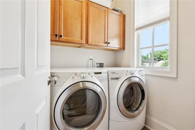 335 Joseph St, New Orleans, LA 70115 - clothes washing area with cabinet space and separate washer and dryer