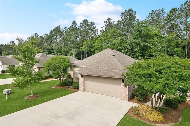 view of front of home with roof with shingles, brick siding, driveway, a garage, and a front lawn