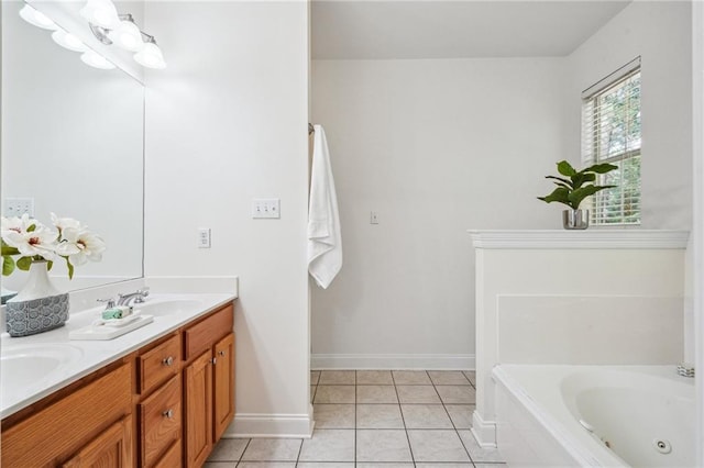 71238 Shady Lake Dr, Covington, LA 70433 - full bath with double vanity, a sink, a tub with jets, tile patterned floors, and baseboards