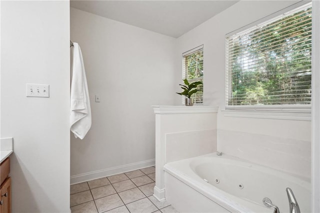 71238 Shady Lake Dr, Covington, LA 70433 - bathroom featuring baseboards, tile patterned floors, a jetted tub, and vanity
