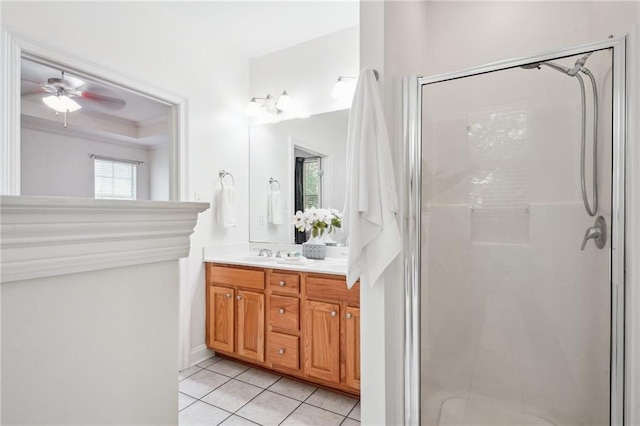 71238 Shady Lake Dr, Covington, LA 70433 - full bathroom featuring a sink, tile patterned floors, a stall shower, ceiling fan, and double vanity