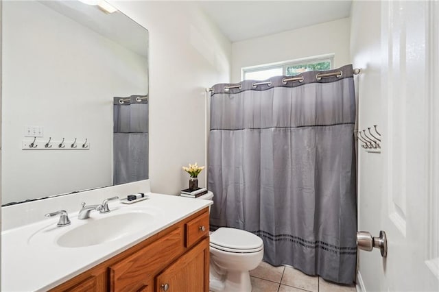 71238 Shady Lake Dr, Covington, LA 70433 - full bath with tile patterned floors, toilet, vanity, and a shower with curtain