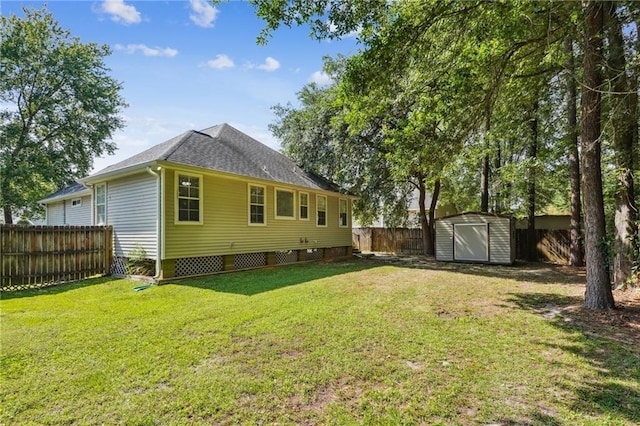 71238 Shady Lake Dr, Covington, LA 70433 - rear view of property with a storage shed, a yard, an outbuilding, and a fenced backyard
