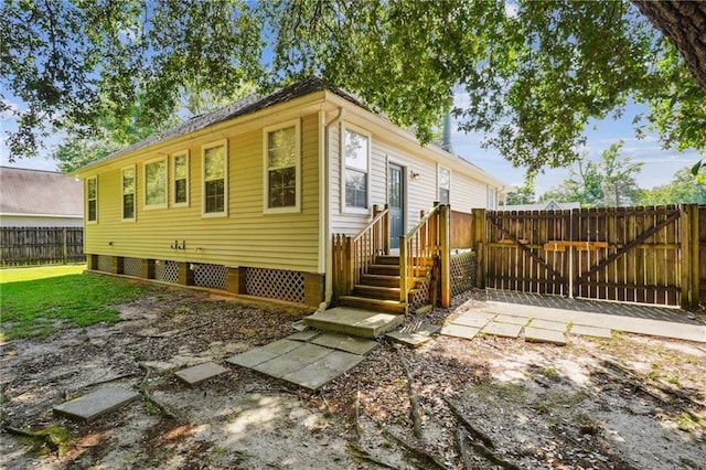 71238 Shady Lake Dr, Covington, LA 70433 - rear view of house featuring a gate and fence