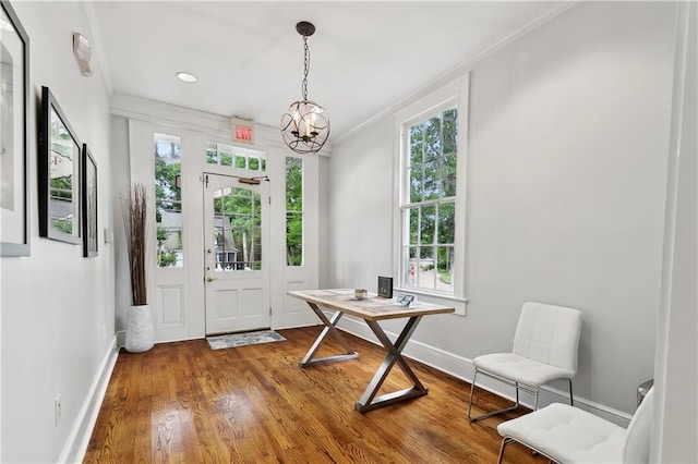 interior space featuring baseboards, a wealth of natural light, and ornamental molding