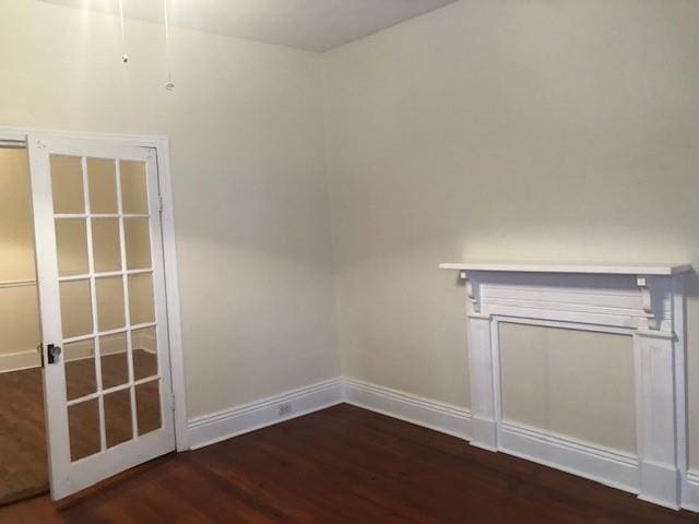 526 Bellecastle St, New Orleans, LA 70115 - unfurnished room with wood finished floors and baseboards