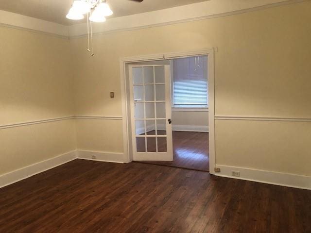 526 Bellecastle St, New Orleans, LA 70115 - unfurnished room featuring dark wood-type flooring, baseboards, and a ceiling fan