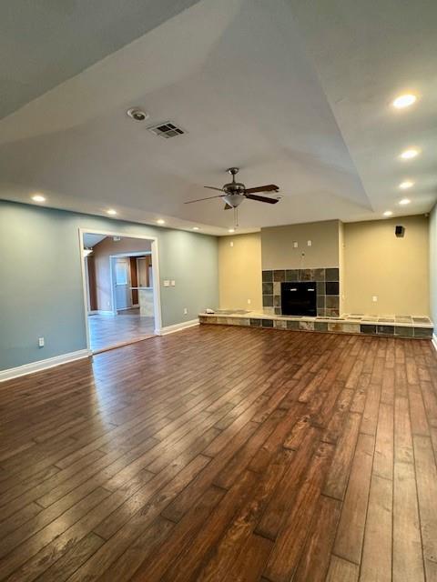 unfurnished living room featuring a ceiling fan, recessed lighting, wood-type flooring, and visible vents