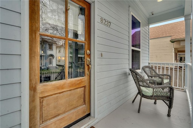 entrance to property with covered porch
