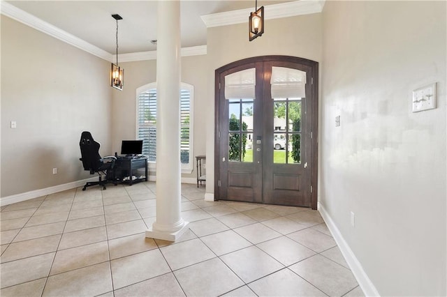 217 Turning Leaf Ln, Madisonville, LA 70447 - entryway featuring arched walkways, healthy amount of natural light, crown molding, french doors, and ornate columns