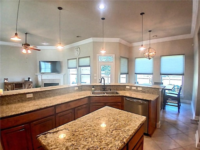 kitchen with ornamental molding, light tile patterned flooring, open floor plan, and a sink