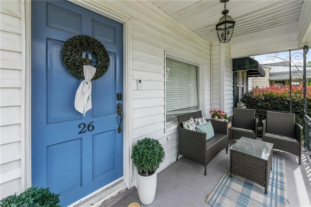 doorway to property with covered porch
