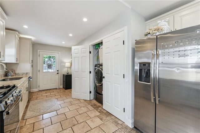 kitchen featuring a sink, recessed lighting, white cabinets, and appliances with stainless steel finishes