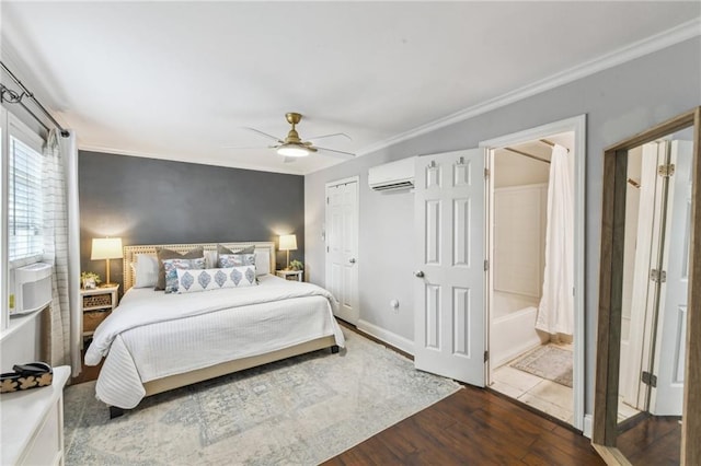 bedroom featuring ceiling fan, dark wood finished floors, crown molding, and a wall mounted AC