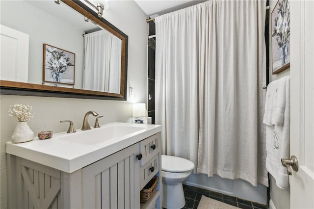 bathroom featuring toilet, tile patterned floors, vanity, and shower / bathtub combination with curtain